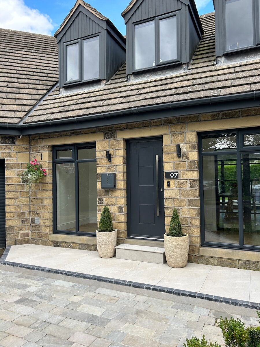 a house with two large planters in front of it